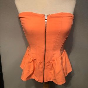 Hot strapless zip up bright orange top.